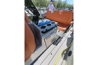 2022 Saxdor 320 GTO boat interior with tan seating and cup holders.