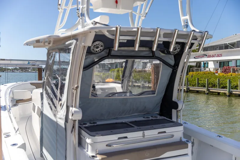  Yacht Photos Pics 2023 Edgewater 370CC boat docked, showcasing sleek design and modern features.