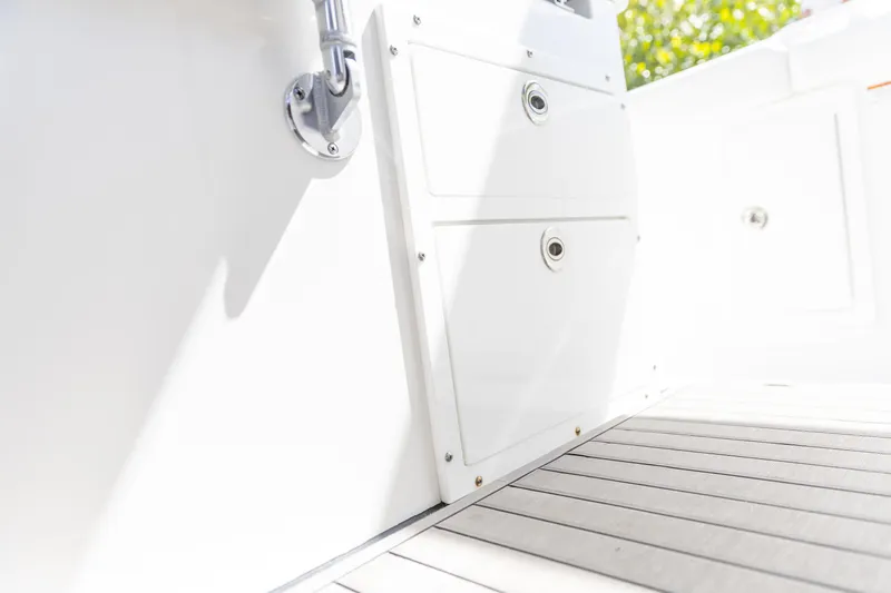  Yacht Photos Pics Edgewater 370CC 2023 boat interior with storage compartments and sleek flooring.