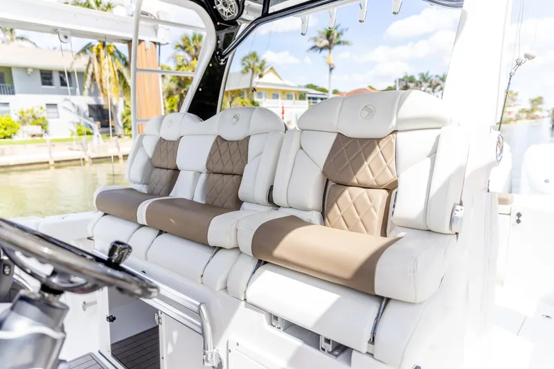  Yacht Photos Pics Luxurious seating on 2023 Edgewater 370CC boat, featuring elegant design and comfortable upholstery.