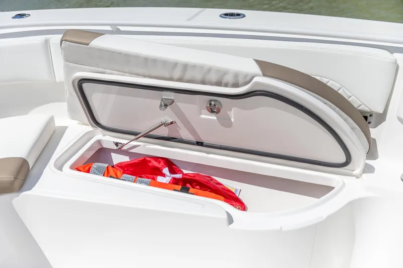  Yacht Photos Pics 2023 Edgewater 370CC boat storage compartment with life jacket inside.