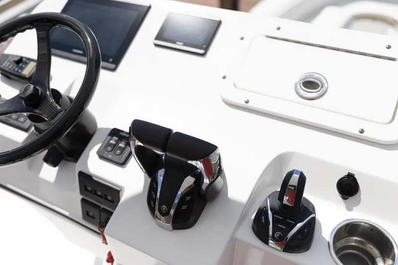  Yacht Photos Pics 2023 Edgewater 370CC boat helm with modern controls and steering wheel.