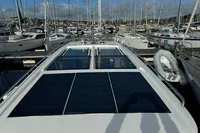 Nimbus C11 2023 yacht with solar panels docked in a marina.