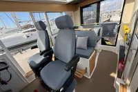 Interior of 2023 Nimbus C11 boat with comfortable seating and modern design.
