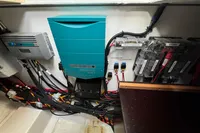 Electrical system setup in a 2023 Nimbus C11 boat, featuring organized wiring and control panels.