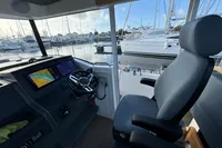 Interior of 2023 Nimbus C11 boat with modern navigation system and comfortable seating.