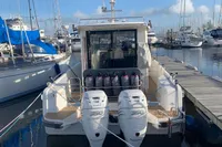 Nimbus C11 2023 boat docked with twin 350 horsepower engines, surrounded by other boats.