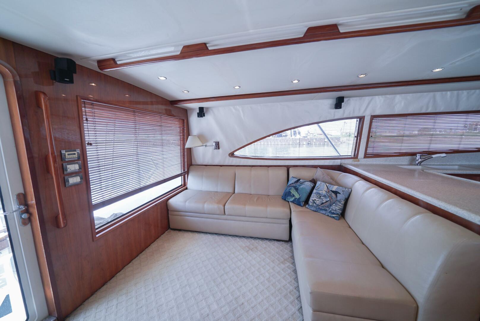 Luxurious interior of a 2007 Bertram 510 Convertible yacht with plush seating.