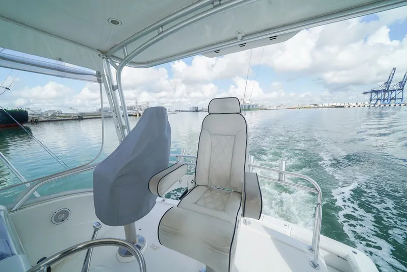 Smoker II Yacht Photos Pics 2007 Bertram 510 Convertible yacht interior with ocean view and seating.