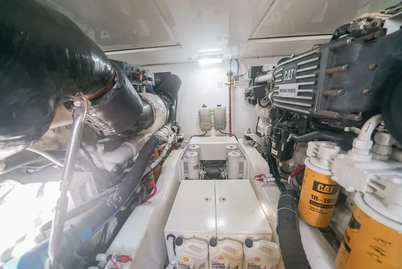 Smoker II Yacht Photos Pics Engine room of a 2007 Bertram 510 Convertible yacht, featuring CAT marine engines.