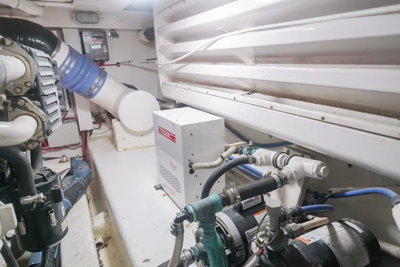 Smoker II Yacht Photos Pics Engine room of 2007 Bertram 510 Convertible yacht, showcasing mechanical components and piping.