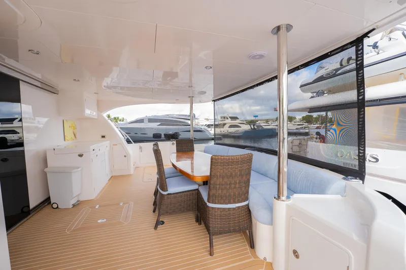 Mystic Soul Yacht Photos Pics Spacious deck of 2019 Horizon PC52 yacht with seating and dining area.