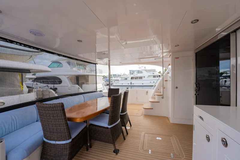Mystic Soul Yacht Photos Pics Spacious 2019 Horizon PC52 yacht deck with dining area and marina view.