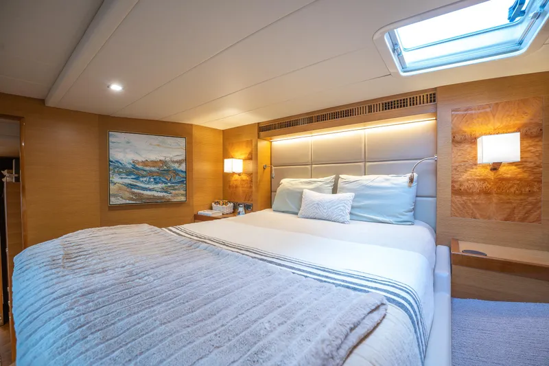 Mystic Soul Yacht Photos Pics Luxurious bedroom interior on 2019 Horizon PC52 yacht with modern decor and soft lighting.