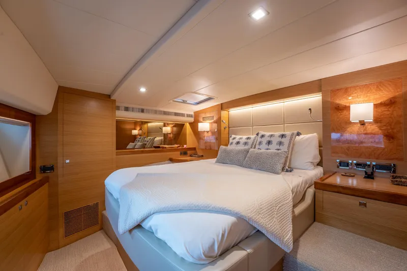 Mystic Soul Yacht Photos Pics Luxurious 2019 Horizon PC52 yacht bedroom with elegant wood finishes and modern lighting.