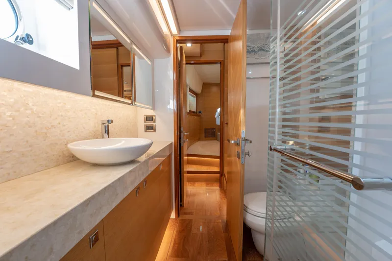 Mystic Soul Yacht Photos Pics Luxurious bathroom interior on 2019 Horizon PC52 yacht, featuring modern fixtures and elegant design.