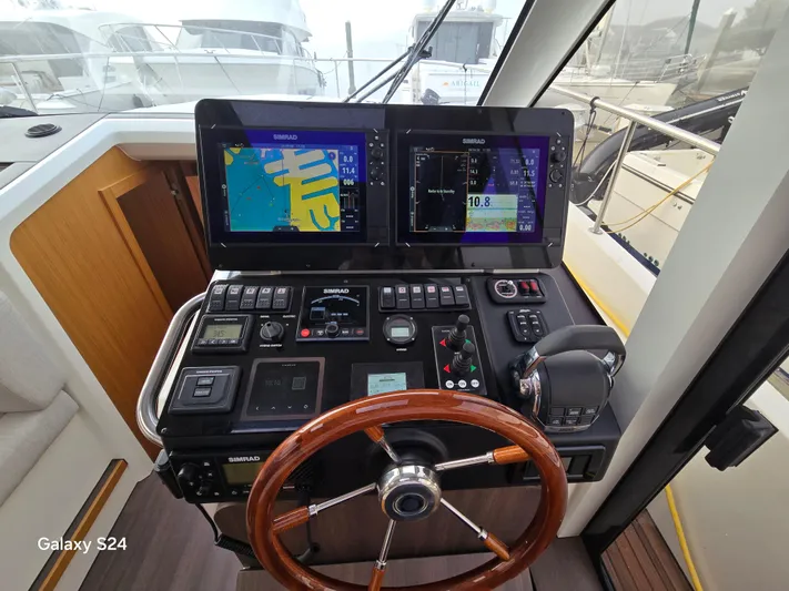 Latitude Adjustment Yacht Photos Pics Helm of 2022 Greenline 39 Hybrid yacht with advanced navigation displays and controls.