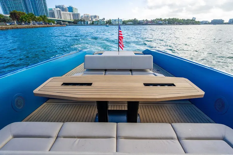 Elizabeth Yacht Photos Pics Luxurious 2022 Wajer 55 S yacht with elegant deck seating and scenic waterfront view.