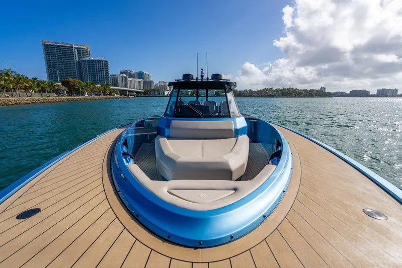 Elizabeth Yacht Photos Pics 2022 Wajer 55 S yacht on water, city skyline in background, sunny day.