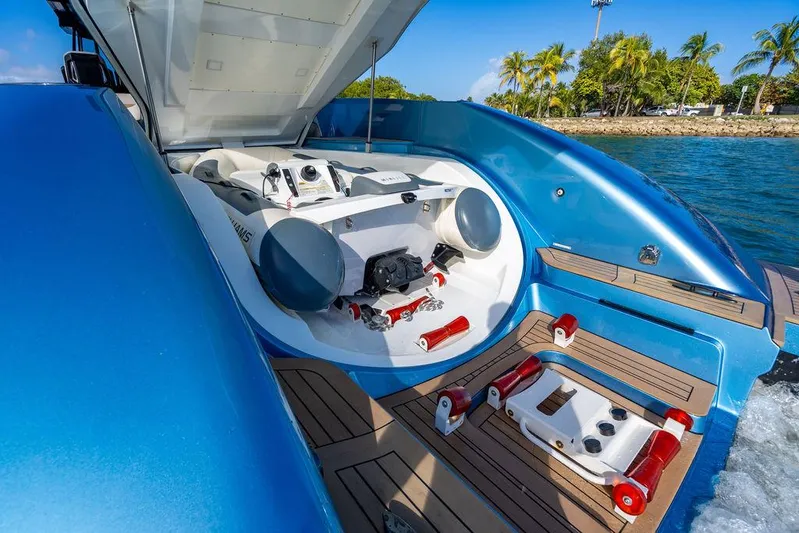 Elizabeth Yacht Photos Pics 2022 Wajer 55 S yacht with open engine compartment, docked near tropical shoreline.