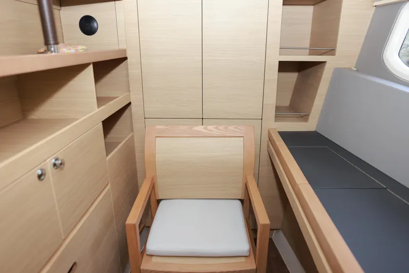  Yacht Photos Pics Interior of 2023 Aquila 44 Yacht with wooden cabinetry and seating.