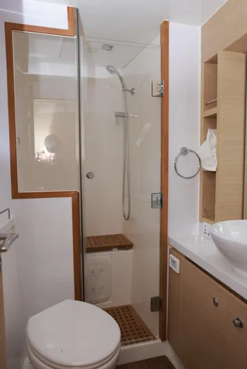  Yacht Photos Pics 2023 Aquila 44 Yacht bathroom with modern shower, toilet, and sink.