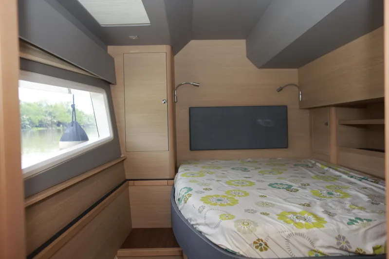  Yacht Photos Pics Interior cabin of 2023 Aquila 44 Yacht with bed and window view.