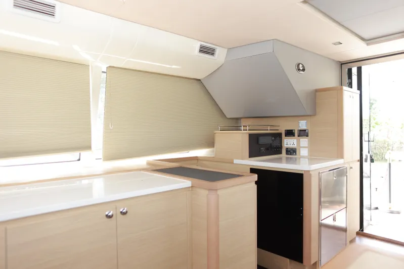  Yacht Photos Pics Modern kitchen interior of 2023 Aquila 44 Yacht with sleek cabinetry and appliances.