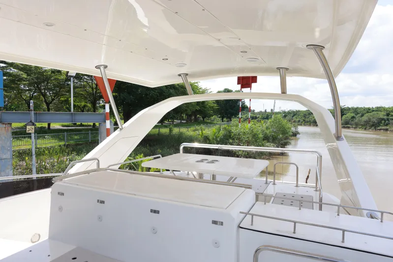  Yacht Photos Pics Aquila 44 Yacht 2023, featuring a sleek deck design, cruising along a scenic river.