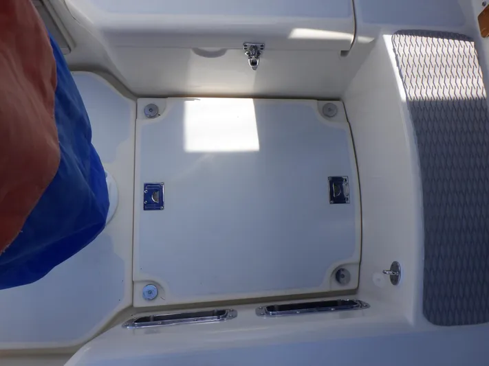 Tapawingo Yacht Photos Pics Cockpit area of a 1998 Pacific Seacraft 40 sailboat, featuring storage compartments.