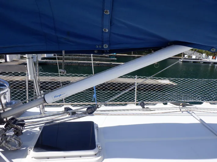 Tapawingo Yacht Photos Pics 1998 Pacific Seacraft 40 sailboat deck with blue canvas and marina background.