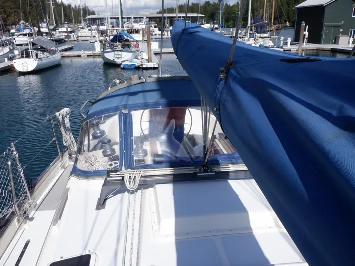 Tapawingo Yacht Photos Pics Sailboat Pacific Seacraft 40, 1998 model, docked at marina with blue sail cover.