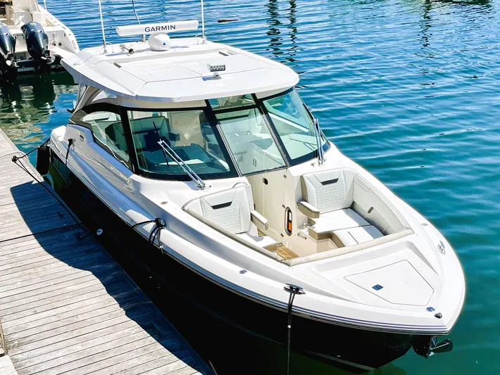 Tinkers Toye Yacht Photos Pics 2024 Tiara Yachts 34 LX docked, showcasing sleek design and modern features.