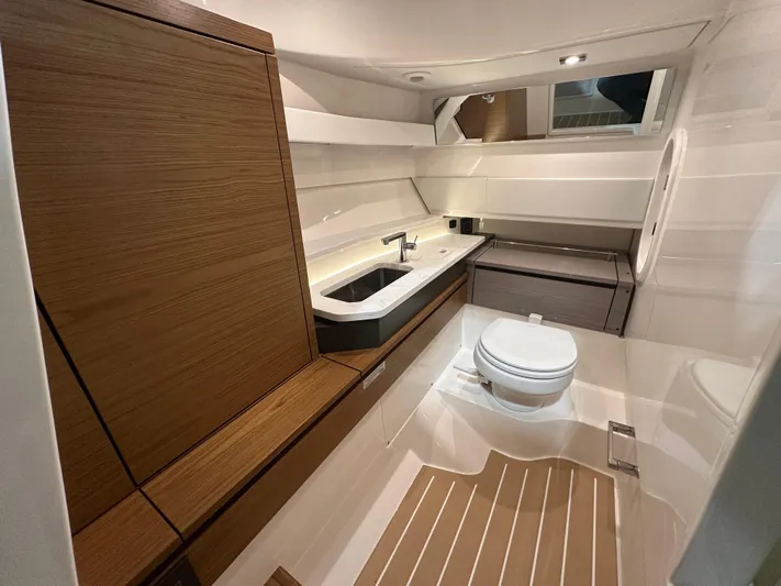 Tinkers Toye Yacht Photos Pics 2024 Tiara Yachts 34 LX bathroom with modern fixtures and wood accents.