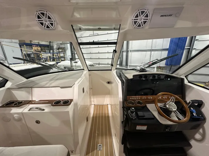 Tinkers Toye Yacht Photos Pics 2024 Tiara Yachts 34 LX cockpit with modern steering and control panel.