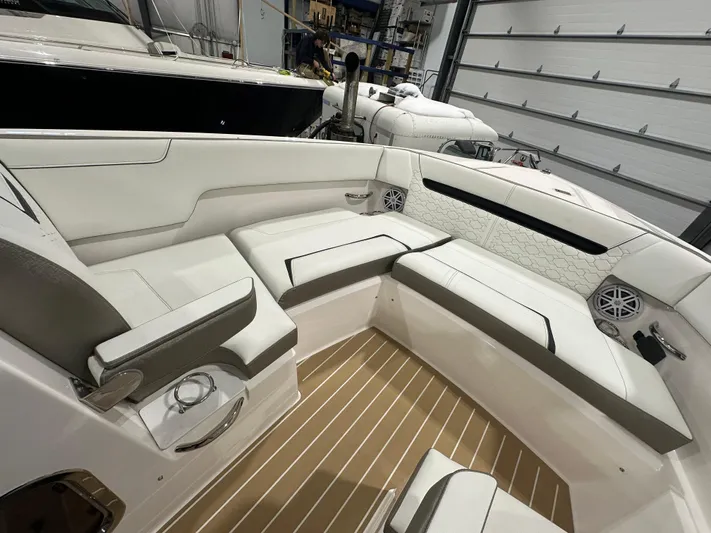 Tinkers Toye Yacht Photos Pics 2024 Tiara Yachts 34 LX interior with white seating and wood flooring.