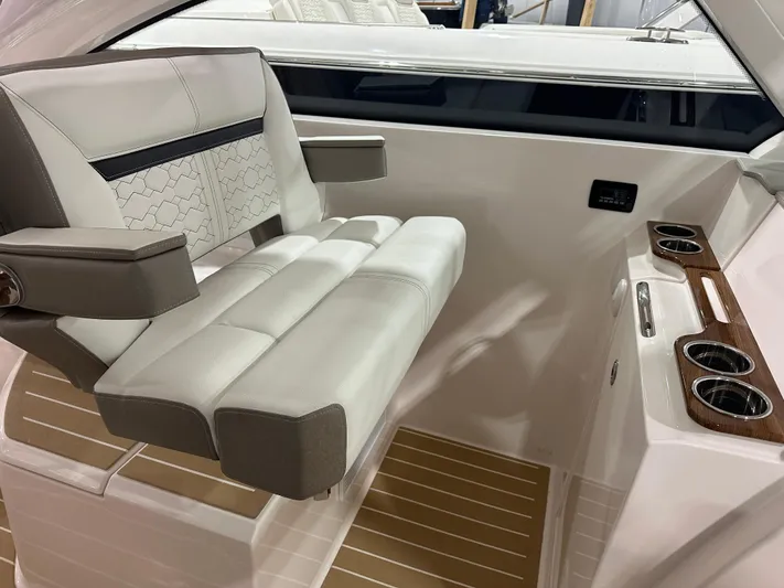 Tinkers Toye Yacht Photos Pics 2024 Tiara Yachts 34 LX interior with luxurious seating and cup holders.