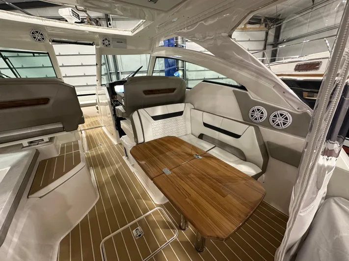 Tinkers Toye Yacht Photos Pics 2024 Tiara Yachts 34 LX interior with elegant seating and wooden table.