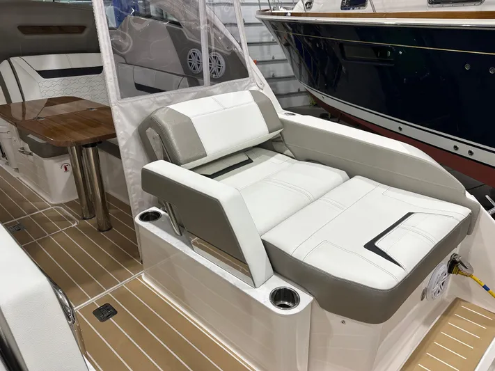 Tinkers Toye Yacht Photos Pics 2024 Tiara Yachts 34 LX interior with luxurious seating and wooden table.