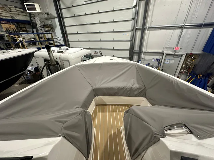 Tinkers Toye Yacht Photos Pics 2024 Tiara Yachts 34 LX boat interior with protective covers in a storage facility.