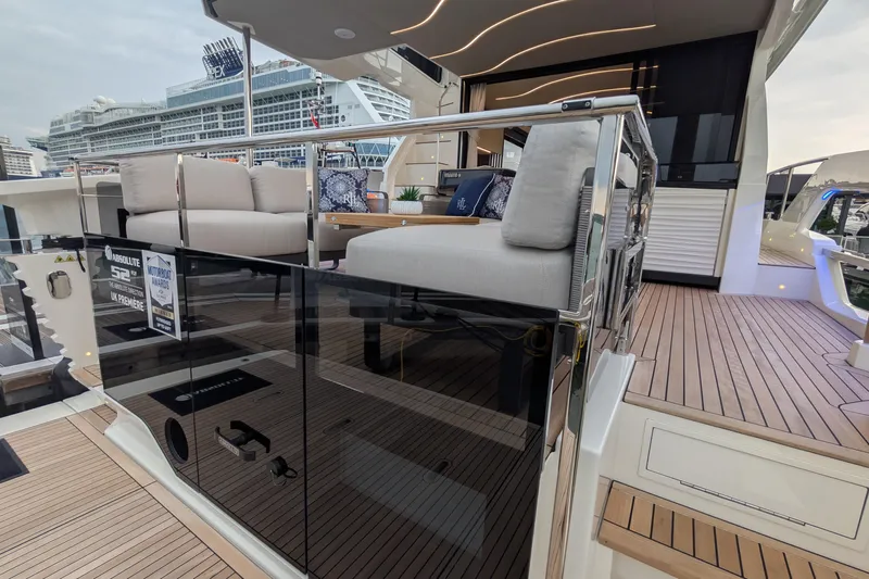  Yacht Photos Pics Luxurious 2025 Absolute 52 FLY yacht with elegant deck seating and modern design.