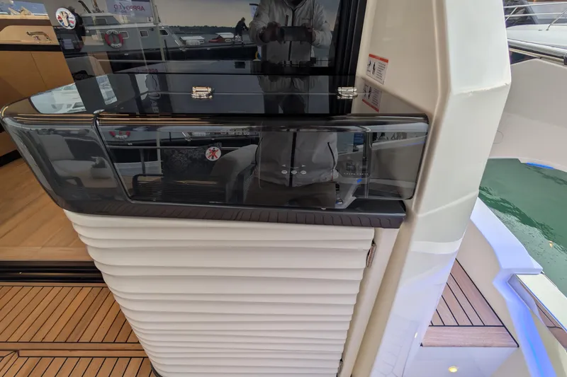  Yacht Photos Pics Modern interior of Absolute 52 FLY yacht, 2025 model, featuring sleek design and wood flooring.