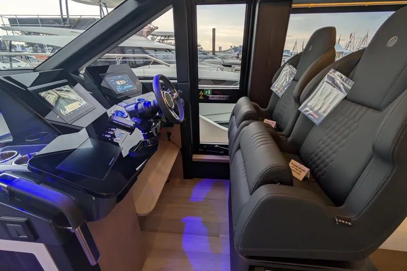  Yacht Photos Pics Interior cockpit of 2025 Absolute 52 FLY yacht with modern controls and seating.