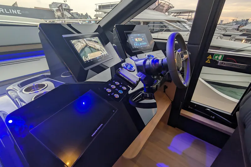  Yacht Photos Pics Cockpit of 2025 Absolute 52 FLY yacht with modern navigation displays and controls.