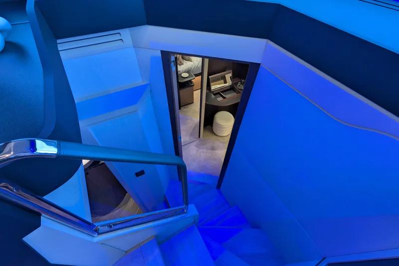  Yacht Photos Pics Staircase with blue lighting on Absolute 52 FLY yacht, 2025 model interior.