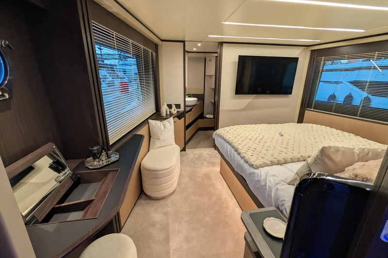  Yacht Photos Pics Luxurious interior of 2025 Absolute 52 FLY yacht with modern bedroom and elegant furnishings.