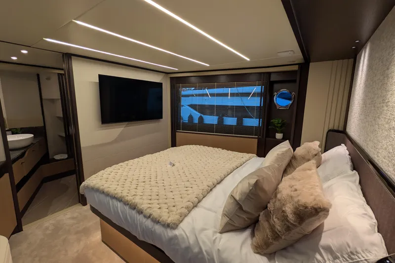  Yacht Photos Pics Luxurious bedroom interior of 2025 Absolute 52 FLY yacht with modern decor and amenities.