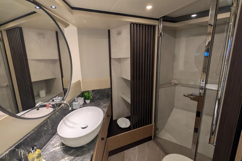  Yacht Photos Pics Luxurious bathroom interior of 2025 Absolute 52 FLY yacht with modern fixtures.