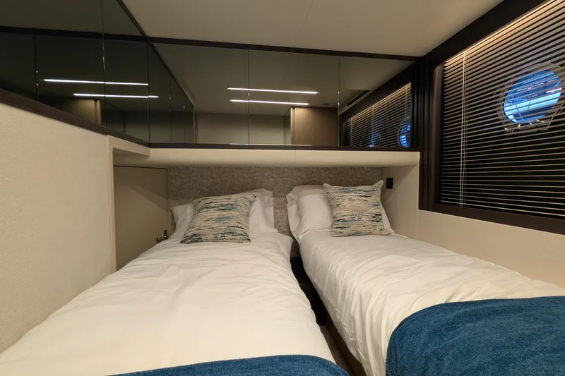  Yacht Photos Pics Luxurious twin cabin interior on 2025 Absolute 52 FLY yacht, featuring modern design and comfort.