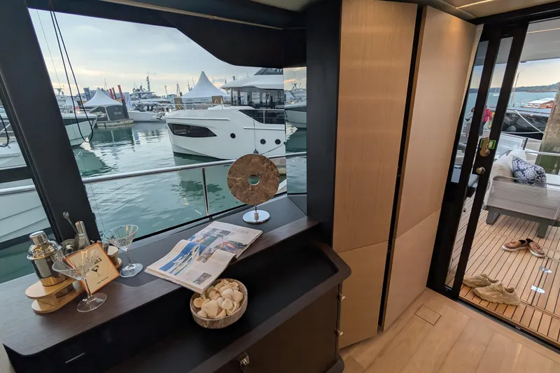  Yacht Photos Pics Luxurious interior of 2025 Absolute 52 FLY yacht with marina view.